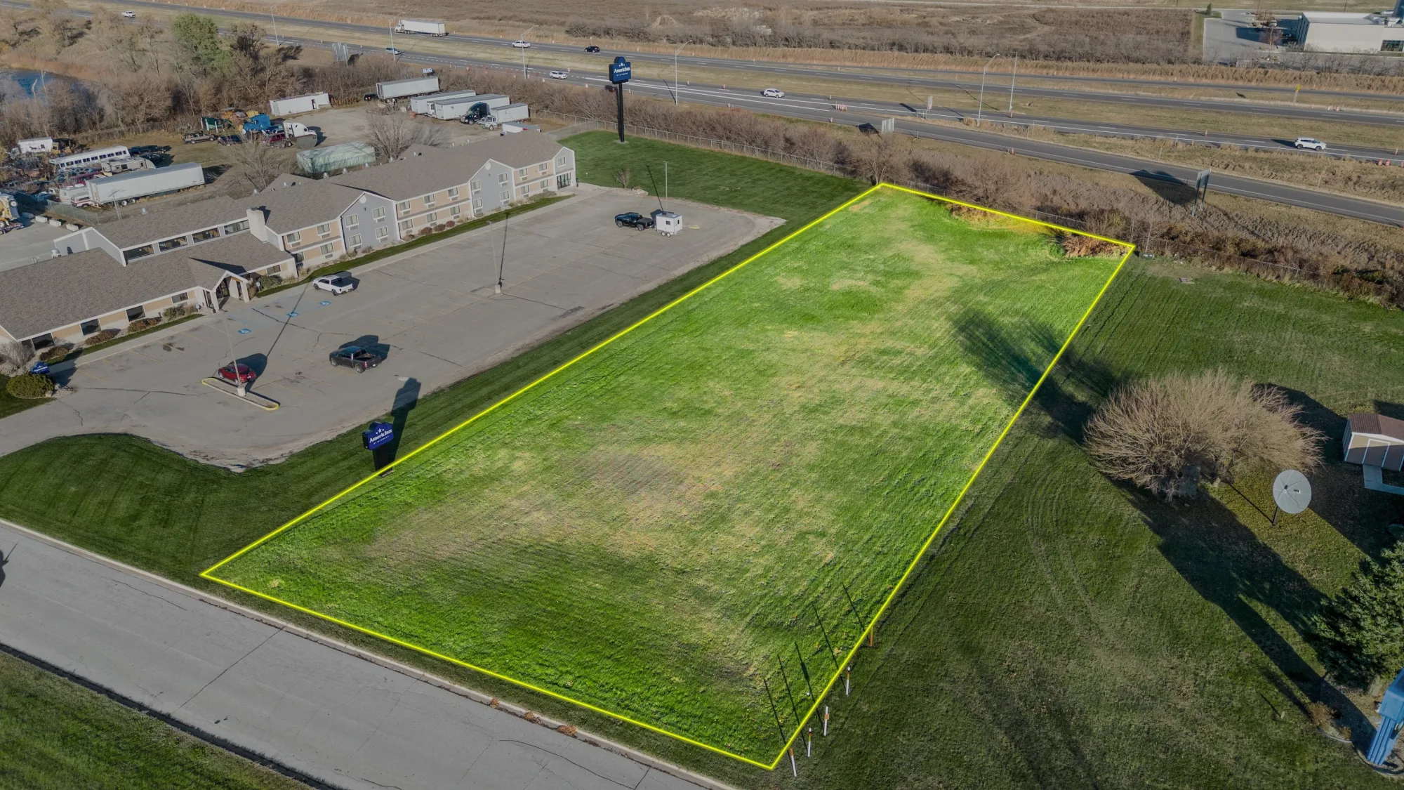 An aerial photograph with the property boundary drawn on it